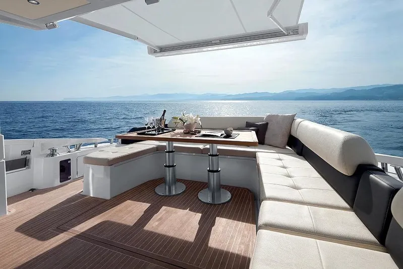 Encore Yacht Photos Pics Luxurious 2015 Azimut 55S yacht deck with elegant seating and ocean view.