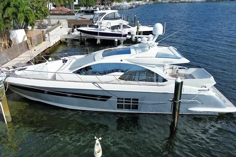 Encore Yacht Photos Pics 2015 Azimut 55S luxury yacht docked in a marina, showcasing sleek design and modern features.