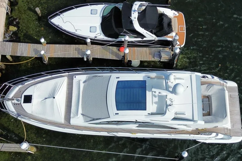 Encore Yacht Photos Pics Overhead view of a 2015 Azimut 55S yacht docked beside another boat.
