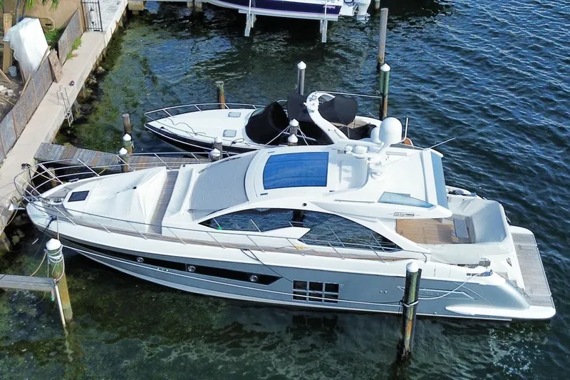 Encore Yacht Photos Pics 2015 Azimut 55S luxury yacht docked at marina, aerial view.