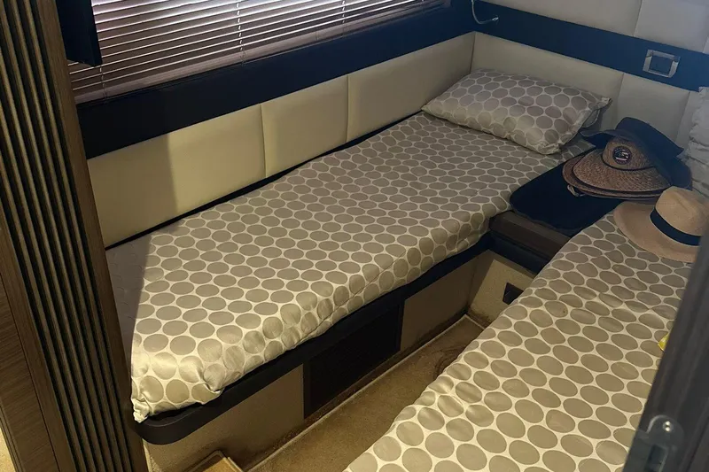 Encore Yacht Photos Pics Interior cabin of 2015 Azimut 55S yacht with twin beds and hats.