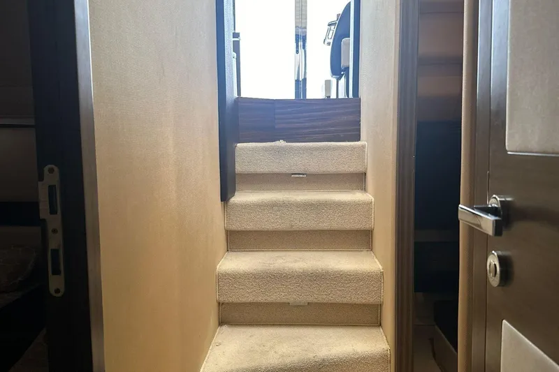 Encore Yacht Photos Pics Interior stairs of 2015 Azimut 55S yacht, leading to upper deck.