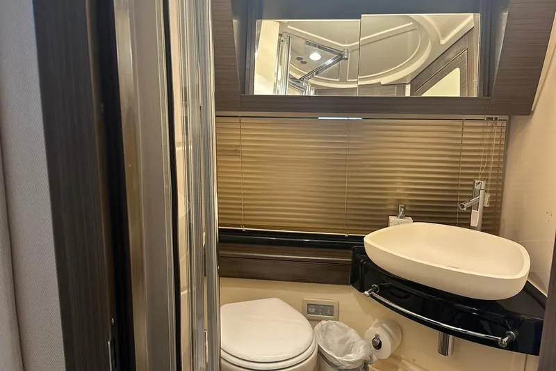 Encore Yacht Photos Pics Luxurious bathroom in 2015 Azimut 55S yacht with modern fixtures and elegant design.