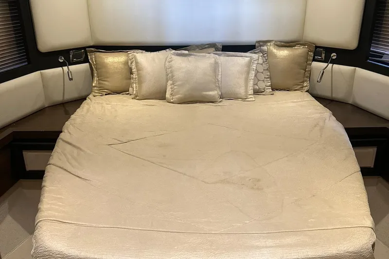 Encore Yacht Photos Pics Luxurious bedroom interior of 2015 Azimut 55S yacht with elegant bedding and cushions.