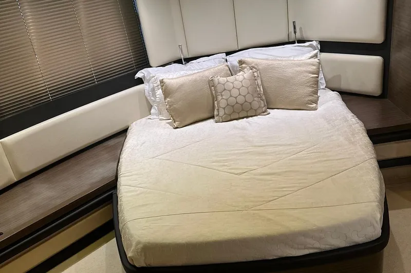 Encore Yacht Photos Pics Luxurious bedroom interior of 2015 Azimut 55S yacht with elegant bedding and cushions.