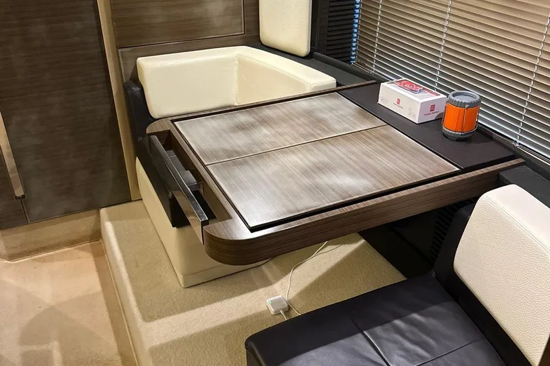 Encore Yacht Photos Pics Interior of 2015 Azimut 55S yacht with modern dining area and wooden table.