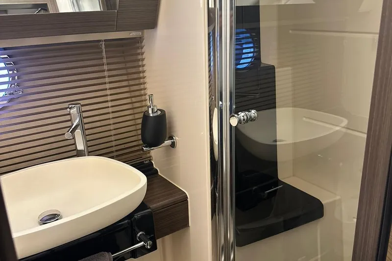 Encore Yacht Photos Pics Luxurious bathroom interior of 2015 Azimut 55S yacht with modern sink and shower.