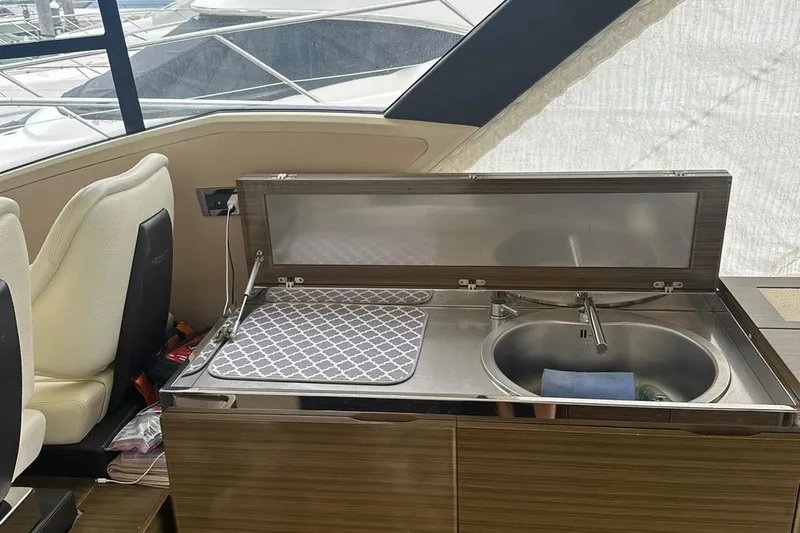 Encore Yacht Photos Pics Interior of 2015 Azimut 55S yacht featuring a compact kitchen sink area.