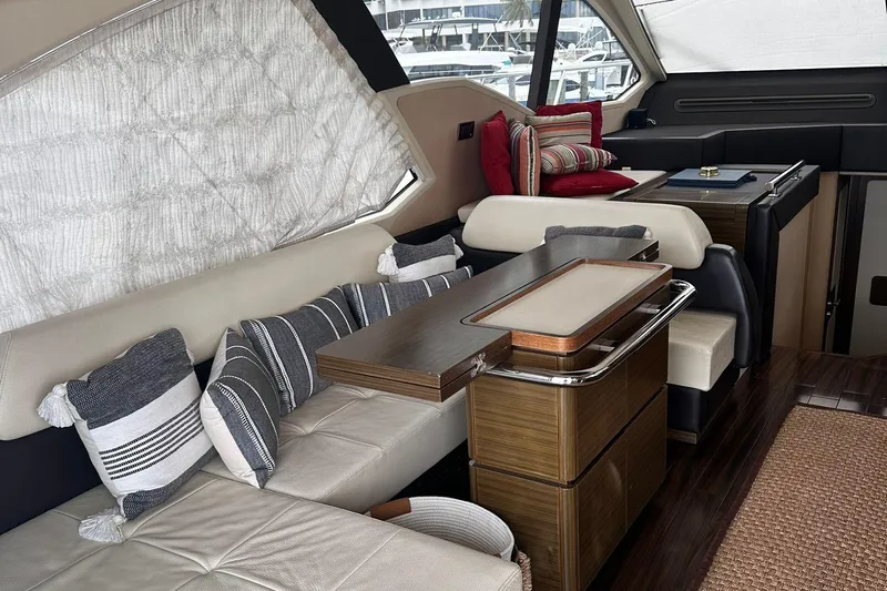 Encore Yacht Photos Pics Luxurious interior of a 2015 Azimut 55S yacht with elegant seating and cushions.