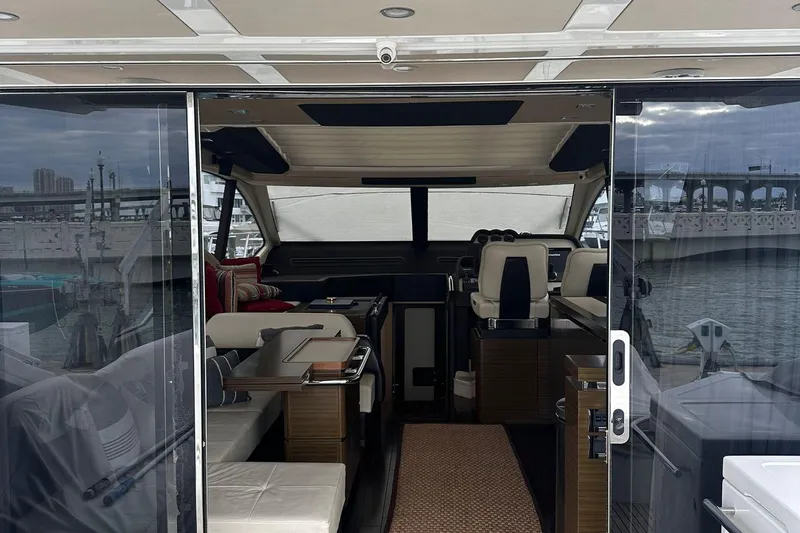 Encore Yacht Photos Pics Interior view of 2015 Azimut 55S yacht with modern seating and helm.