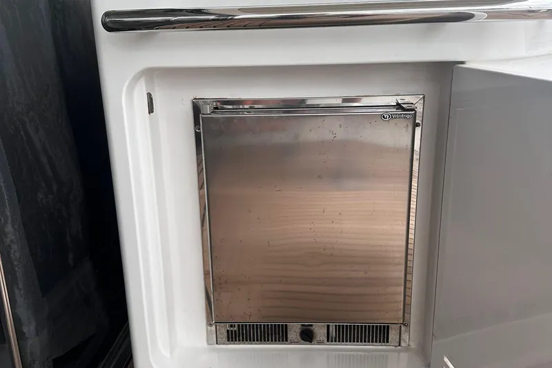 Encore Yacht Photos Pics Stainless steel fridge on 2015 Azimut 55S yacht, featuring Vitifrigo design.