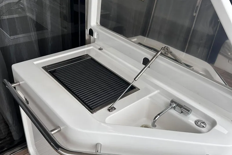 Encore Yacht Photos Pics Outdoor grill and sink on 2015 Azimut 55S yacht deck.