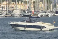 2007 Cranchi CSL 27 boat named Emma in a marina, surrounded by yachts.