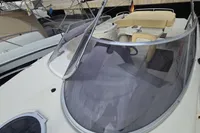 2007 Cranchi CSL 27 boat with sleek design and spacious seating area.