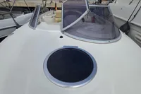2007 Cranchi CSL 27 boat deck with windshield and hatch, docked in a marina.
