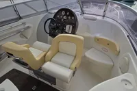 2007 Cranchi CSL 27 boat interior with steering wheel and beige seating.