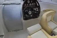 2007 Cranchi CSL 27 boat interior with steering wheel and beige seating.