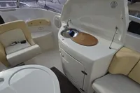 Interior of 2007 Cranchi CSL 27 boat with seating and compact kitchenette.