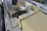 2007 Cranchi CSL 27 boat interior with beige seating and steering console.