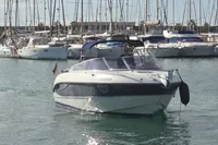 2007 Cranchi CSL 27 boat navigating a marina with numerous docked sailboats.