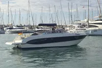 2007 Cranchi CSL 27 boat in marina, surrounded by sailboats, with a German flag.