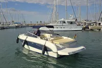 2007 Cranchi CSL 27 boat docked in a marina, surrounded by sailboats.