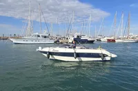 2007 Cranchi CSL 27 boat in marina, surrounded by sailboats under a blue sky.