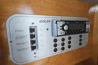 Control panel of a 2007 Cranchi CSL 27 boat with audio system and switches.