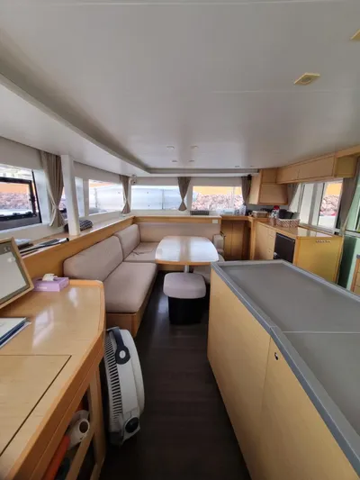 Fellowship Yacht Photos Pics Interior of 2017 Lagoon 450 F catamaran with spacious seating and modern kitchen area.