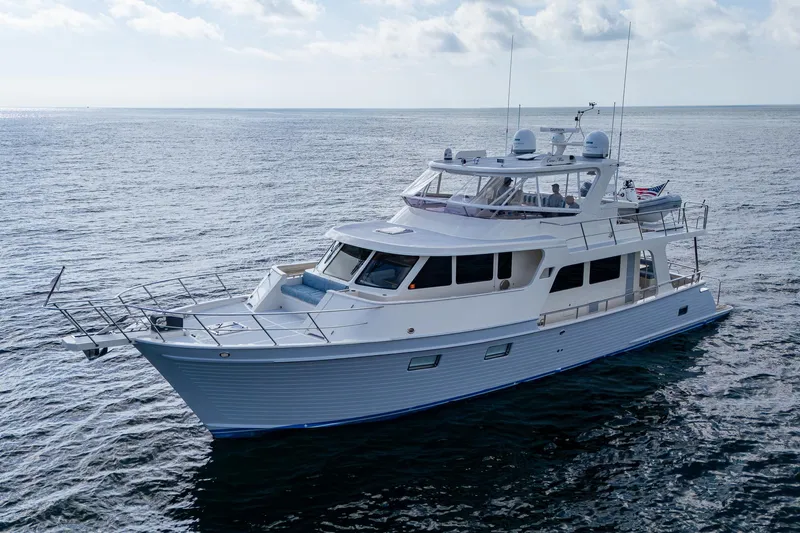 Cara Mia Yacht Photos Pics Marlow 53E Explorer 2021 yacht cruising on open sea under cloudy sky.