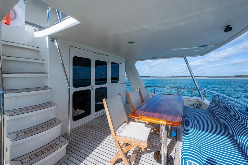 Cara Mia Yacht Photos Pics Outdoor deck of 2021 Marlow 53E Explorer yacht with seating and ocean view.