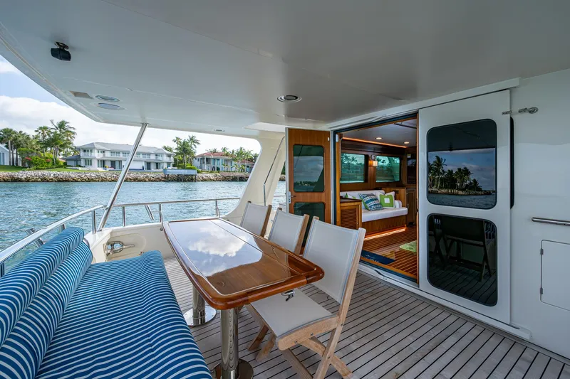 Cara Mia Yacht Photos Pics Luxury Marlow 53E Explorer yacht deck with seating and scenic waterfront view, 2021 model.