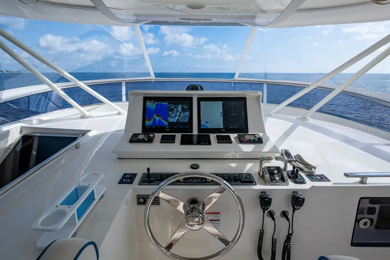 Cara Mia Yacht Photos Pics Cockpit of 2021 Marlow 53E Explorer yacht with navigation screens and ocean view.