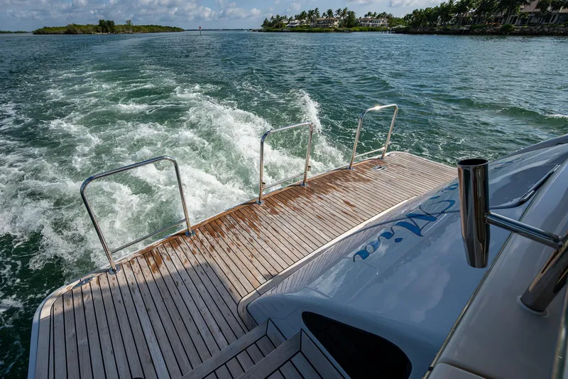 Cara Mia Yacht Photos Pics Stern view of 2021 Marlow 53E Explorer yacht cruising on open water.