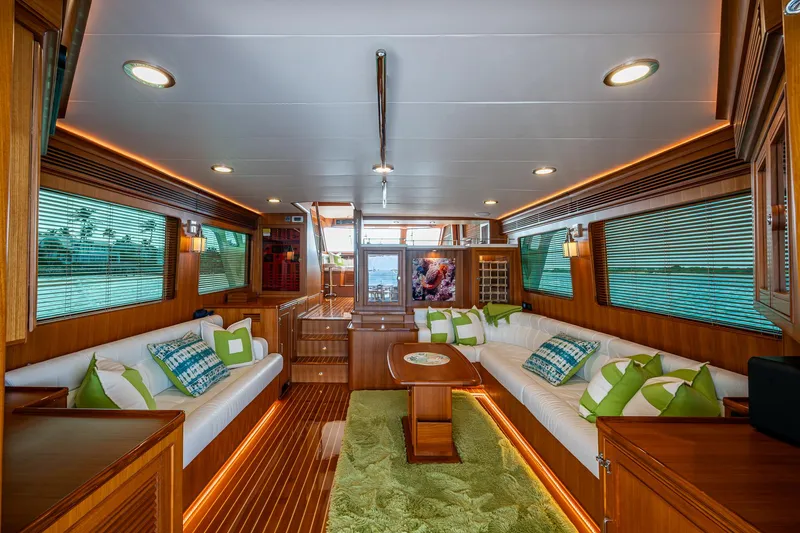 Cara Mia Yacht Photos Pics Luxurious interior of 2021 Marlow 53E Explorer yacht with elegant wood finishes and plush seating.