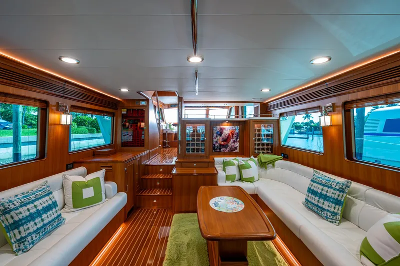 Cara Mia Yacht Photos Pics Luxurious interior of 2021 Marlow 53E Explorer yacht with elegant seating and wood finishes.