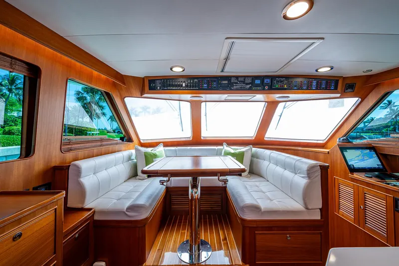 Cara Mia Yacht Photos Pics Luxurious interior of 2021 Marlow 53E Explorer yacht with elegant seating and panoramic windows.