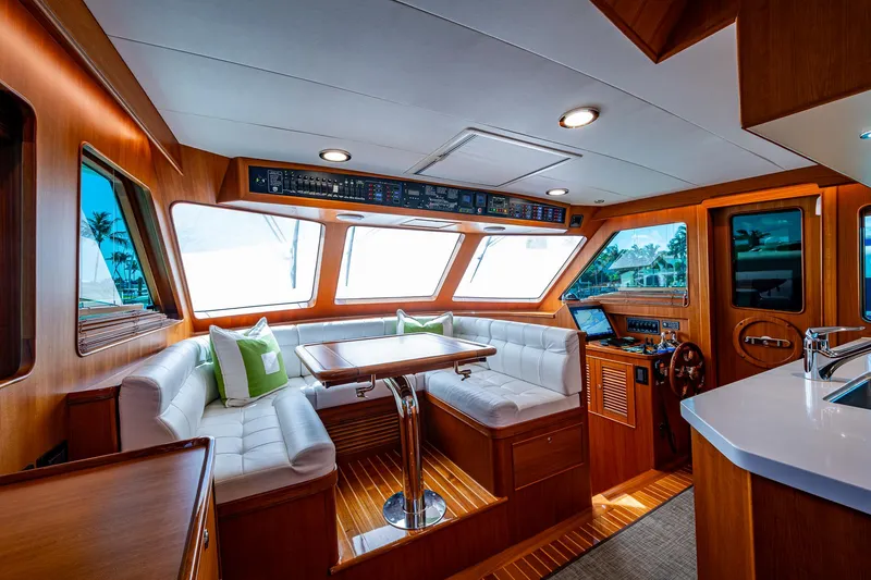 Cara Mia Yacht Photos Pics Luxurious interior of 2021 Marlow 53E Explorer yacht with plush seating and modern design.