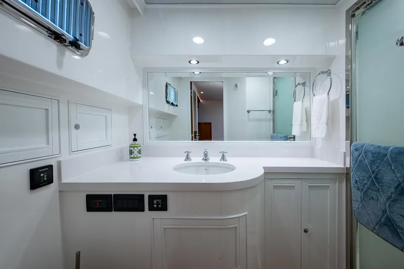 Cara Mia Yacht Photos Pics Luxurious bathroom in 2021 Marlow 53E Explorer yacht, featuring modern fixtures and elegant design.