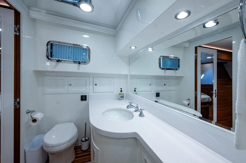 Cara Mia Yacht Photos Pics Luxurious bathroom in 2021 Marlow 53E Explorer yacht with modern fixtures and elegant design.