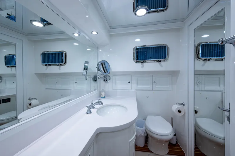 Cara Mia Yacht Photos Pics Luxurious bathroom in 2021 Marlow 53E Explorer yacht with modern fixtures and elegant design.