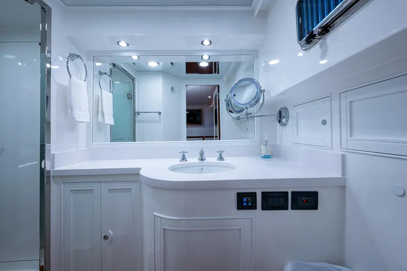 Cara Mia Yacht Photos Pics Luxurious bathroom in 2021 Marlow 53E Explorer yacht, featuring modern fixtures and elegant design.