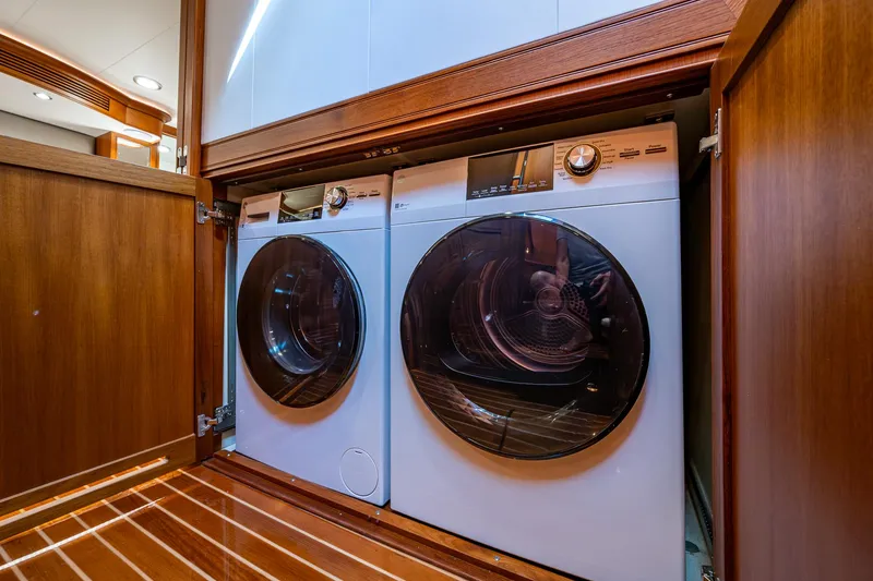 Cara Mia Yacht Photos Pics Laundry area with washer and dryer on Marlow 53E Explorer yacht, 2021 model.