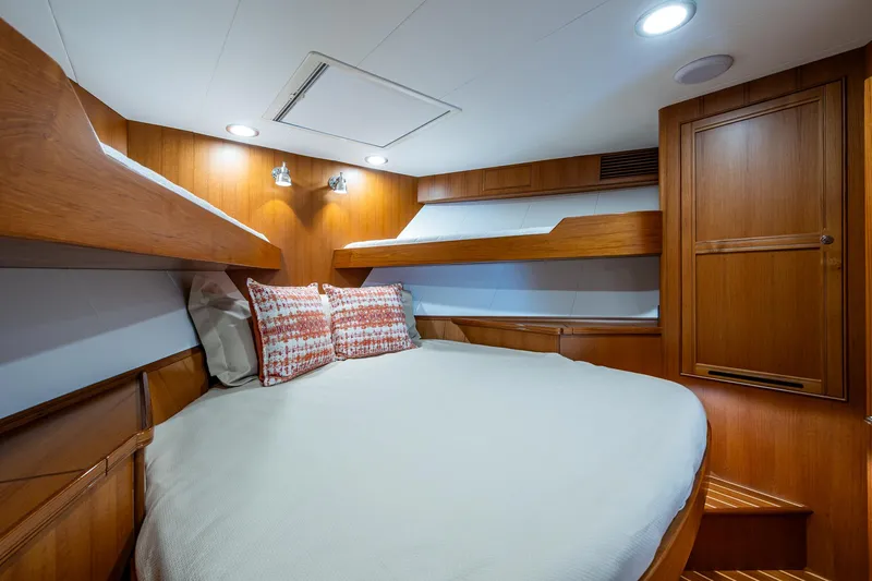 Cara Mia Yacht Photos Pics Luxurious cabin interior of 2021 Marlow 53E Explorer yacht with cozy bedding.