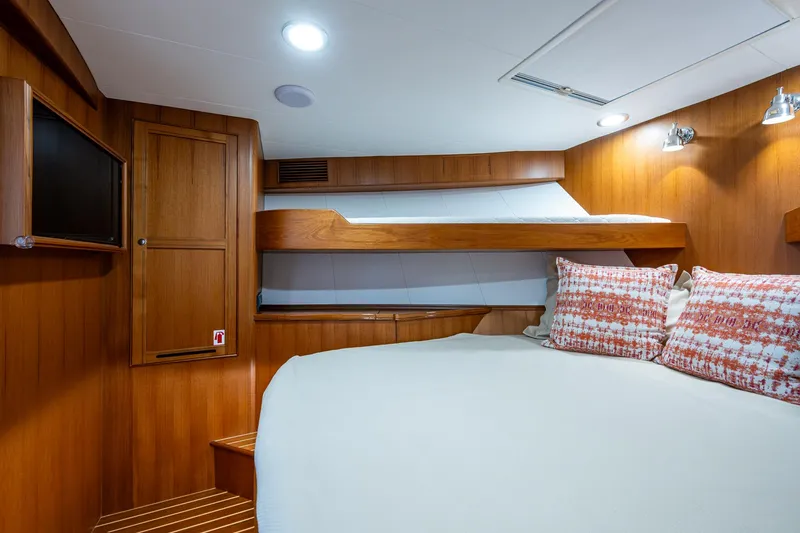 Cara Mia Yacht Photos Pics Luxurious cabin interior of 2021 Marlow 53E Explorer yacht with cozy bedding.