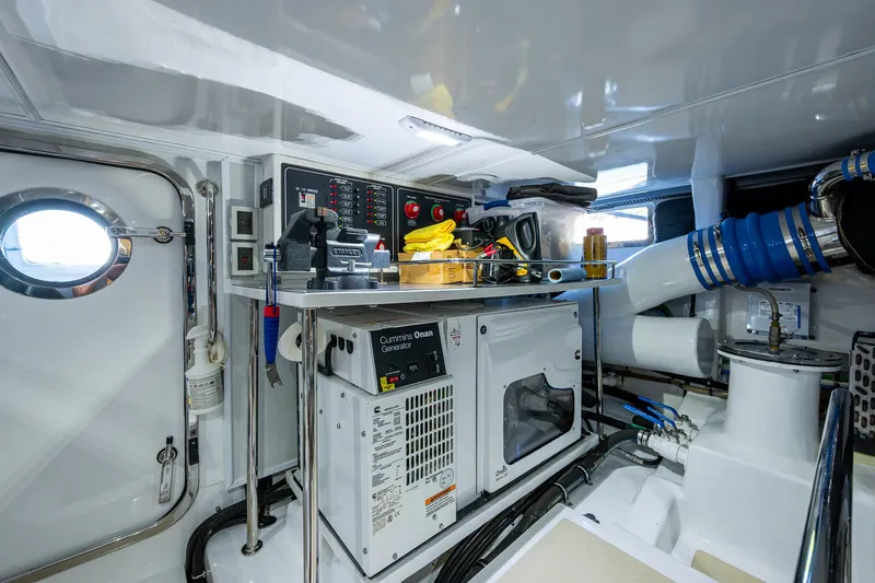 Cara Mia Yacht Photos Pics Engine room of 2021 Marlow 53E Explorer yacht with control panels and equipment.