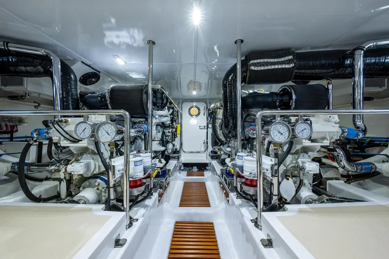 Cara Mia Yacht Photos Pics Engine room of 2021 Marlow 53E Explorer yacht, showcasing advanced machinery and gauges.