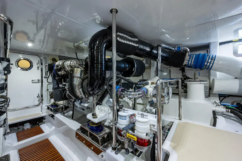 Cara Mia Yacht Photos Pics Engine room of 2021 Marlow 53E Explorer yacht, showcasing advanced machinery and clean design.
