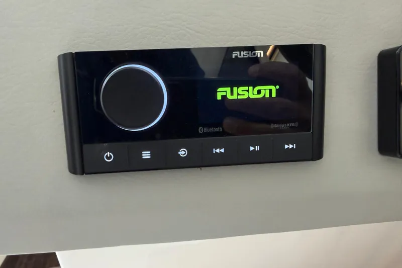 Monet Yacht Photos Pics Fusion audio control panel on 2021 Regal 36 XO boat dashboard.