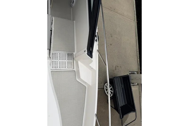 Monet Yacht Photos Pics 2021 Regal 36 XO boat deck with dockside view and cart.